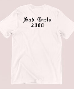 Unisex T-shirt featuring a nostalgic 'Sad Girls 2000' graphic, inspired by early 2000s aesthetics and emo or indie culture. The design may include vintage-inspired fonts, moody color schemes like black, purple, or pastel tones, and possibly imagery like hearts, tears, or emotive symbols to evoke the nostalgic sadness and introspection of that era
