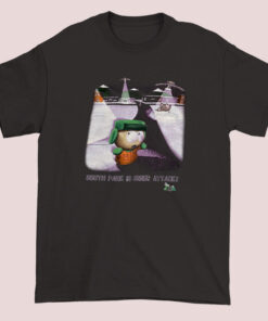 A unisex adult T-shirt featuring a 1998 South Park design with cartoon characters and a playful 'Under Attack' theme, showcasing vibrant colors and humorous artwork inspired by the popular animated series
