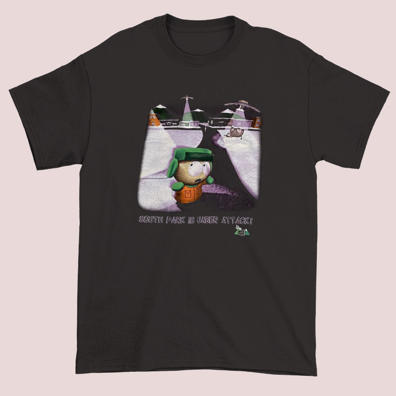1998 South Park Is Under Attack Unisex adult T shirt 2 A unisex adult T-shirt featuring a 1998 South Park design with cartoon characters and a playful 'Under Attack' theme, showcasing vibrant colors and humorous artwork inspired by the popular animated series