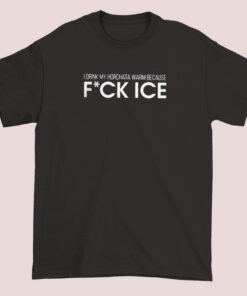 A unisex adult T-shirt with bold text that reads 'I drink my horchata warm because fuck ice,' expressing a humorous and fiery beverage preference