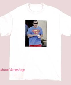 Unisex adult T-shirt featuring a fun and creative design of Adam Sandler as Superman, inspired by Zach Schwartz, blending comedy and superhero themes