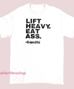 T-shirt with bold text that reads 'Lift Heavy, Eat Ass, Gandhi,' combining humorous and provocative phrases with a playful design