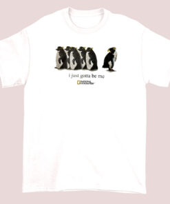 White or light-colored t-shirt featuring a National Geographic-inspired design with a penguin and the phrase 'I just gotta be me,' highlighting a fun and adventurous theme