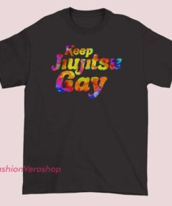 A vibrant, colorful "Keep Jiu Jitsu Gay" graphic T-shirt featuring bold, rainbow-themed lettering celebrating LGBTQ+ pride and support for the Jiu Jitsu community.