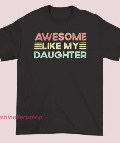 A retro-style T-shirt featuring the phrase "Awesome Like My Daughter" with bold, vintage-inspired lettering and vibrant colors.
