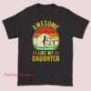 A humorous gift T-shirt for dads that says "Awesome Like My Daughter" with playful font and design, perfect for showcasing pride and humor.