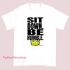 A Kendrick Lamar T-shirt featuring the lyrics "Be HUMBLE" with a bold, stylish design highlighting his message of humility and respect.