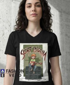 Scott Pilgrim Playing Bass Shirt featuring comic-inspired character art, bass guitar, indie rock culture, retro gaming aesthetics, alternative fashion, and casual cotton tee style.